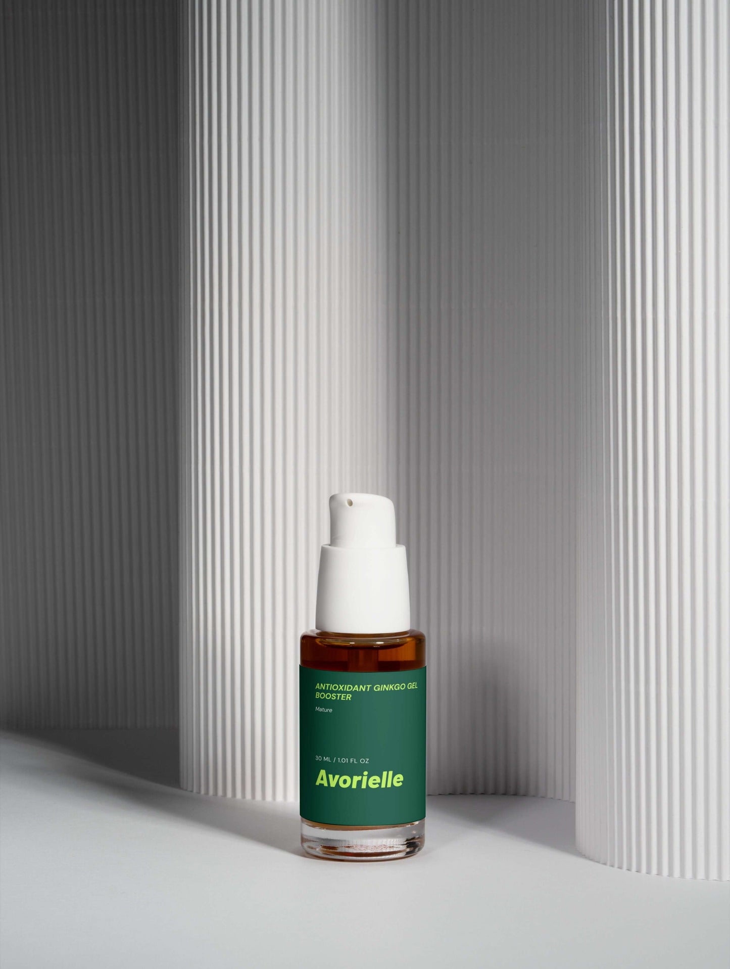 Antioxidant Ginkgo Gel Booster from Avorielle in a sleek bottle against textured white background.