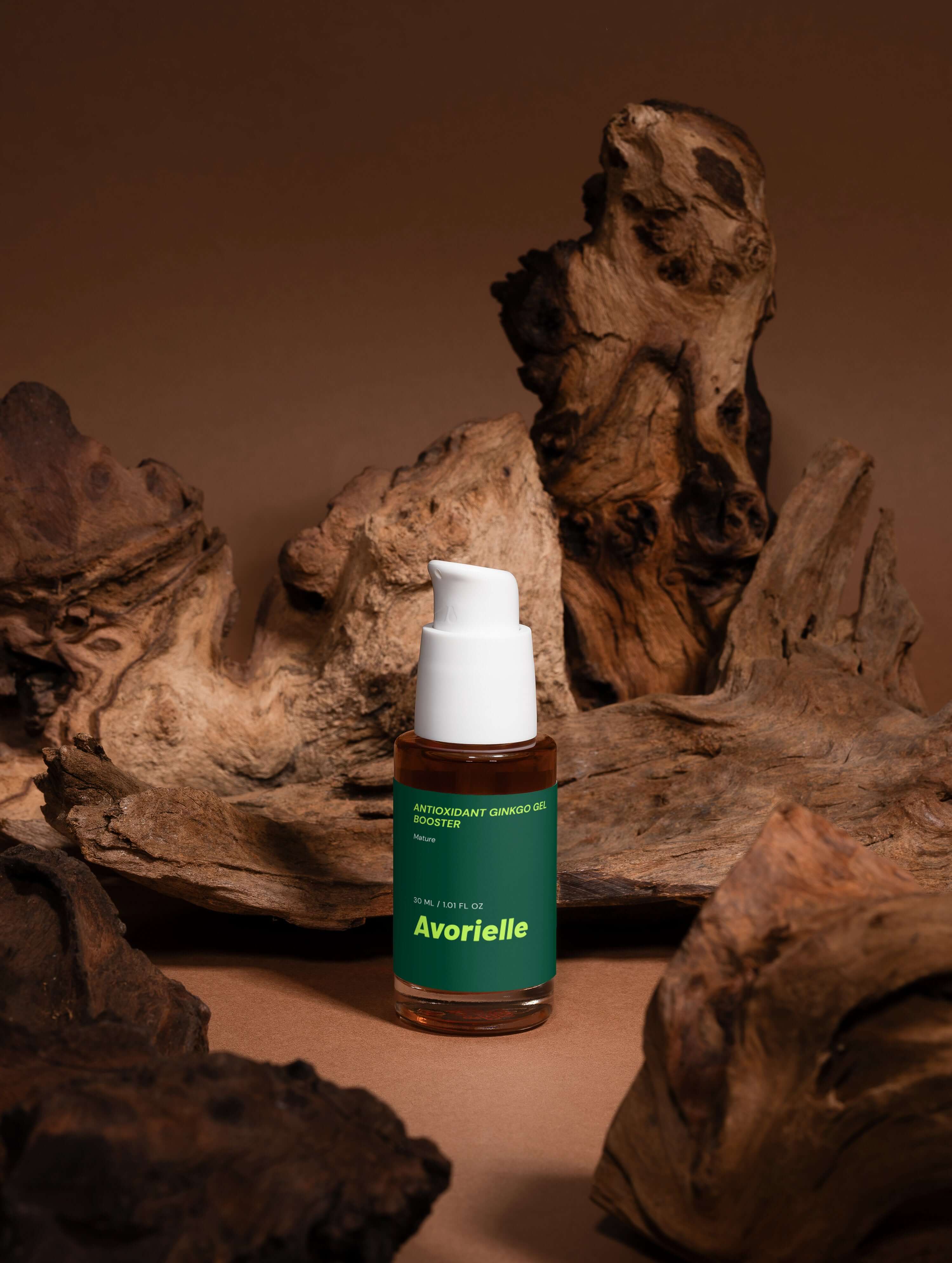 Antioxidant Ginkgo Gel Booster bottle on natural wood background, showcasing its youthful skin benefits.