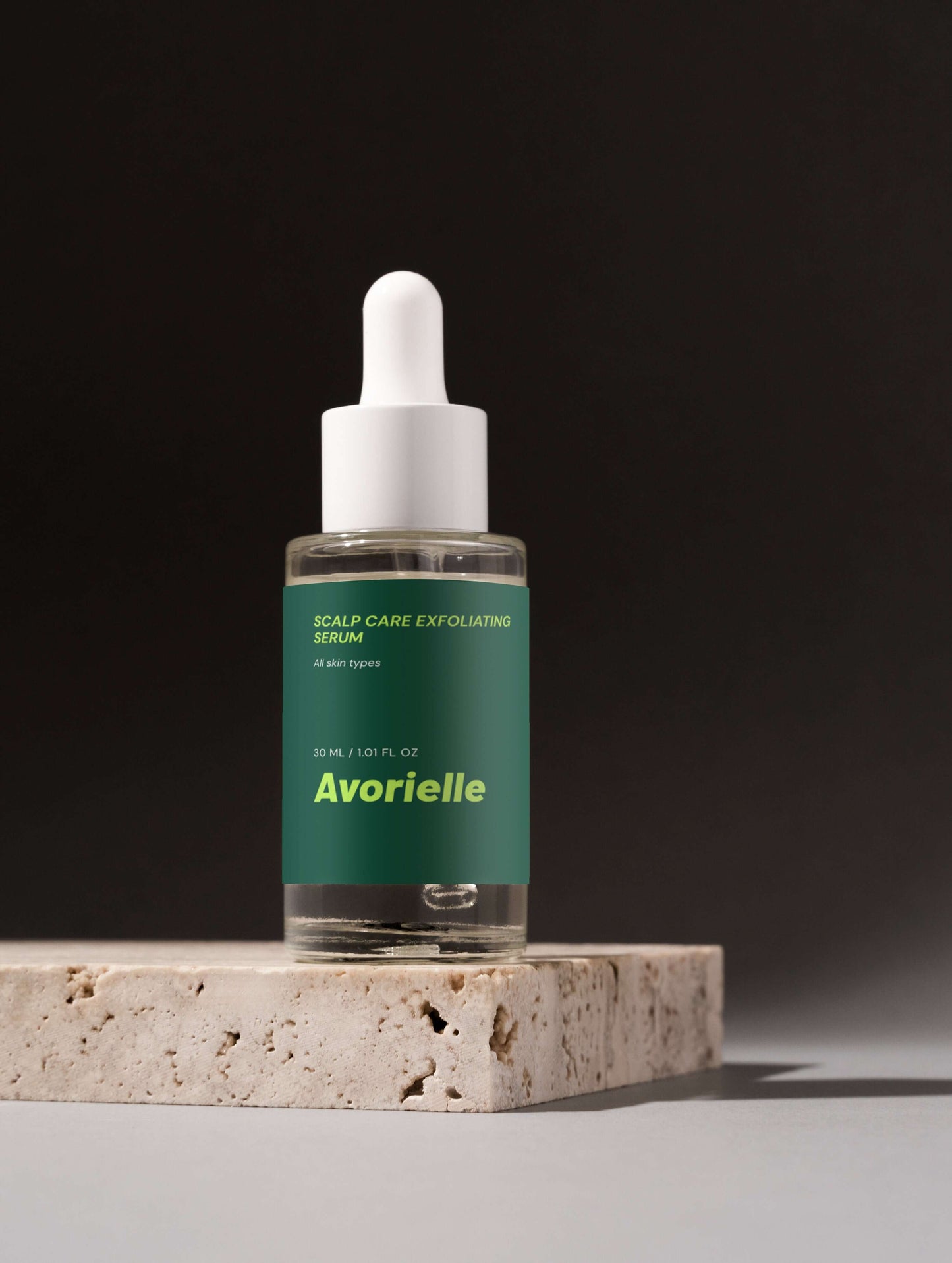 Scalp Care Exfoliating Serum bottle on a stone surface, ideal for promoting scalp exfoliating serum benefits.